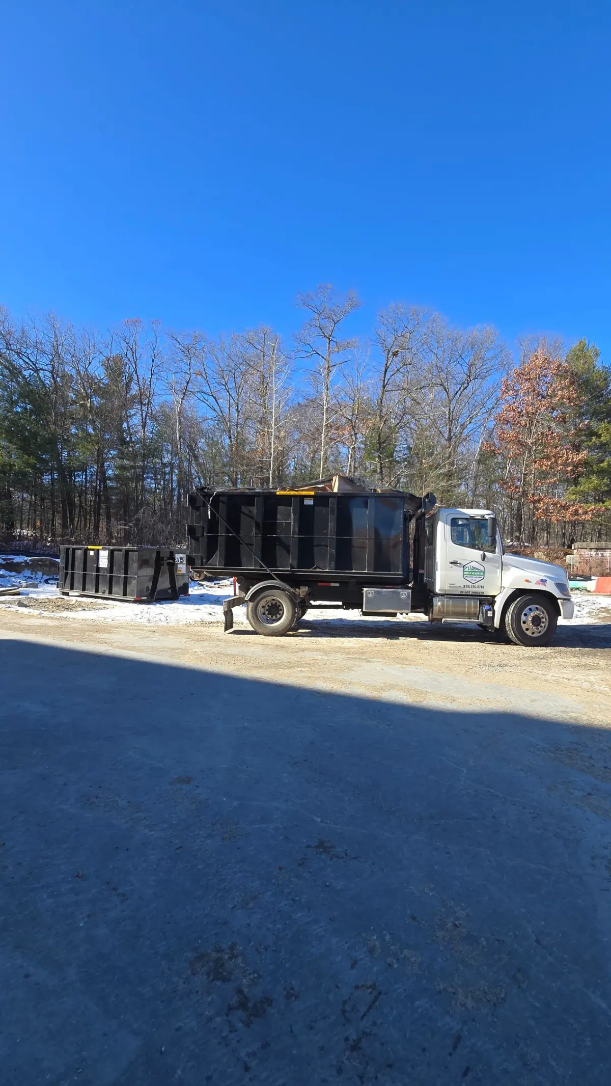 Dumpster delivery on a Tyngsborough driveway